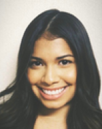 A photo of Christella from the shoulders up with a solid white background.