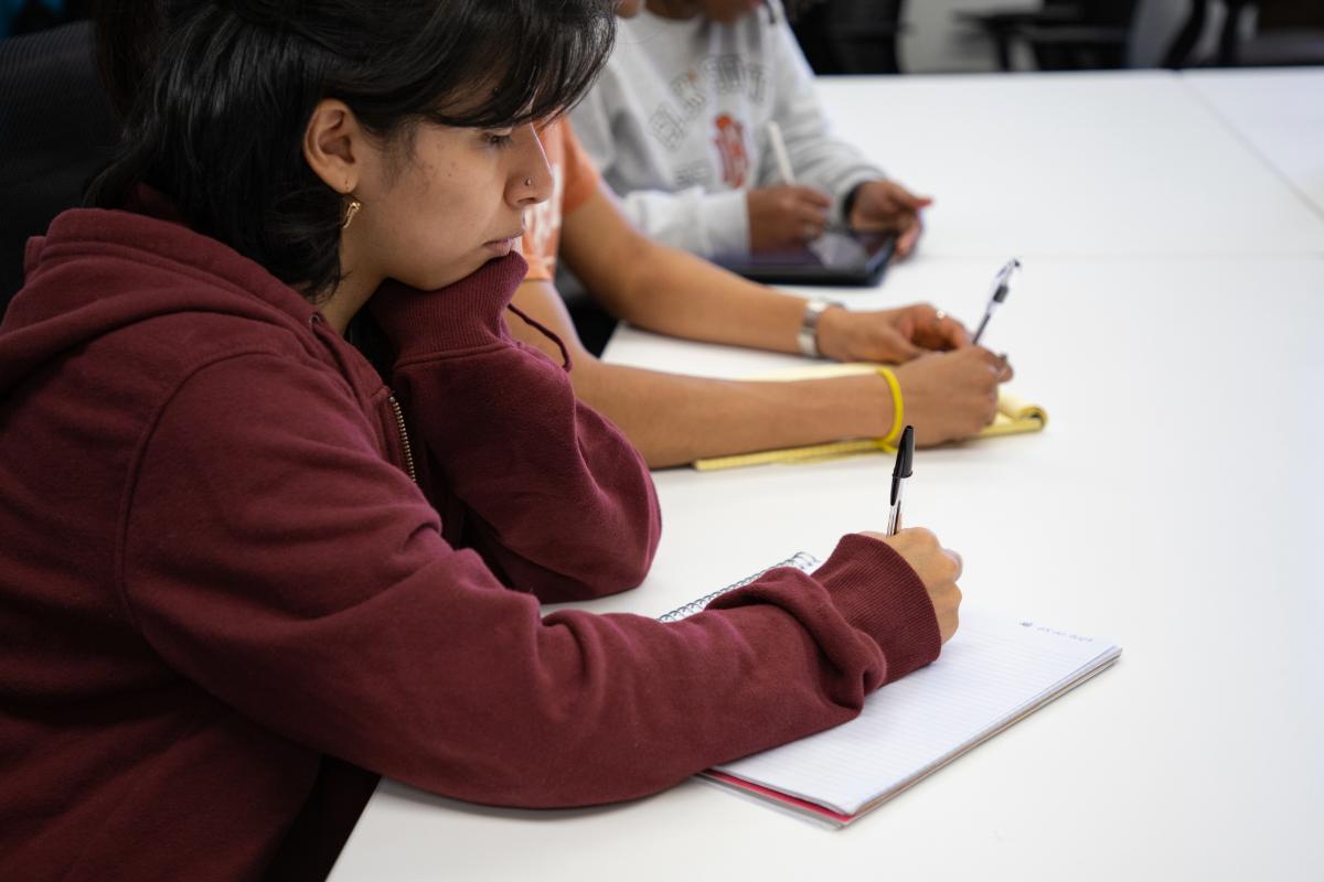 Student taking notes