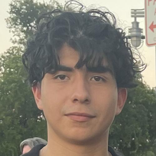 Eric's headshot in front of a tree