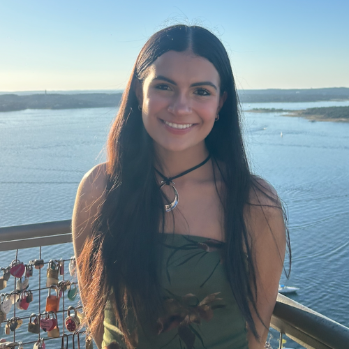 Close-up of Emily with water in the background