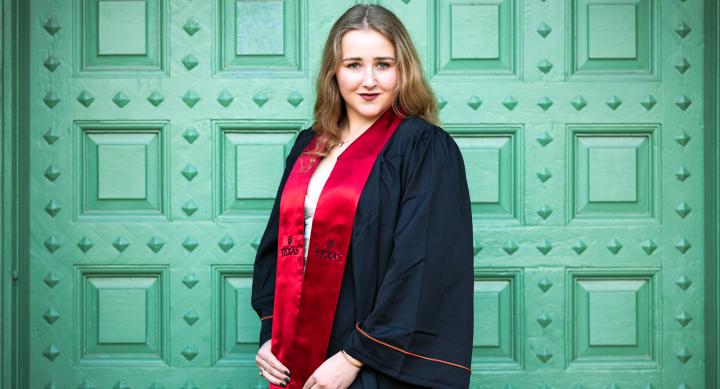 Jordan Morgan wearing graduation gown