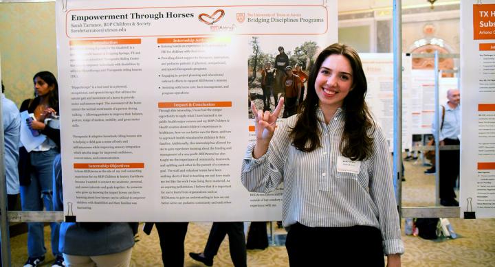 Sarah Tarrance in front of her poster at the BDP poster session